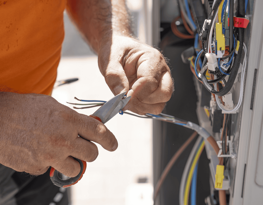 electrician cutting and repairing electrical wires in Columbia MO