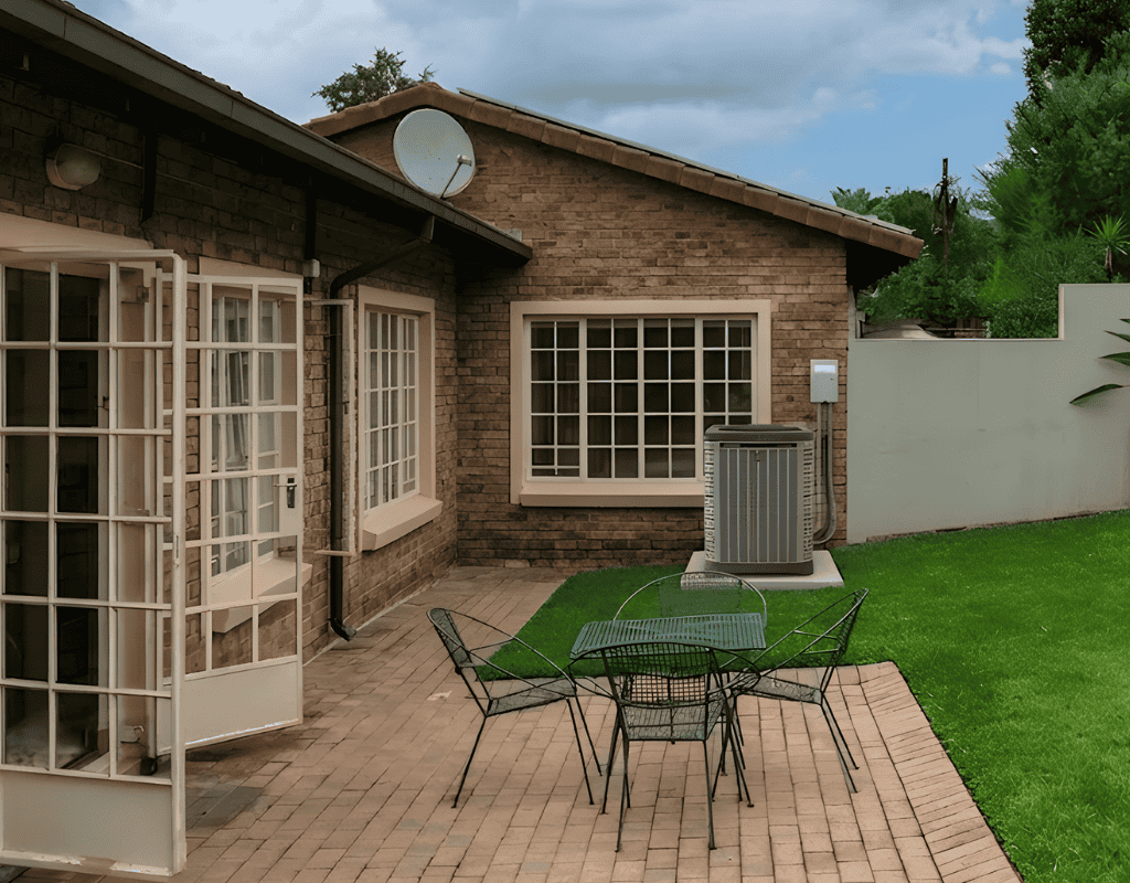 outdoor air conditioning unit servicing at residential home in Columbia MO